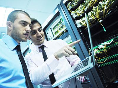 Two network engineers in server room