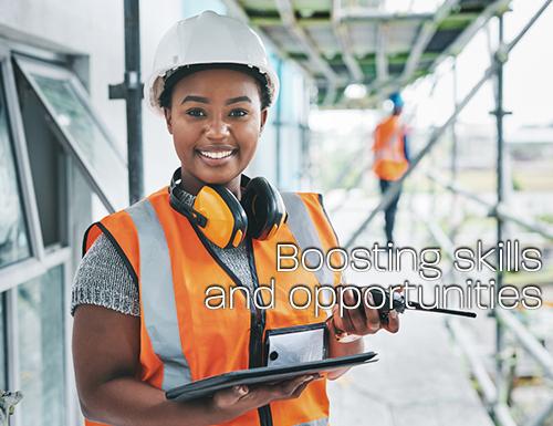 Female construction worker wearing hi vis uniform.