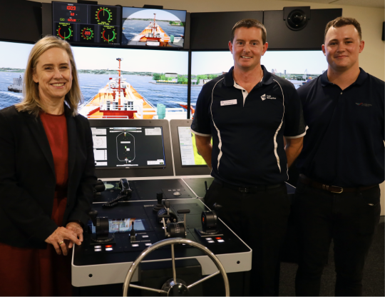 Minister McGuirk at South Metropolitan TAFE Marine Simulator opening with two lecturers